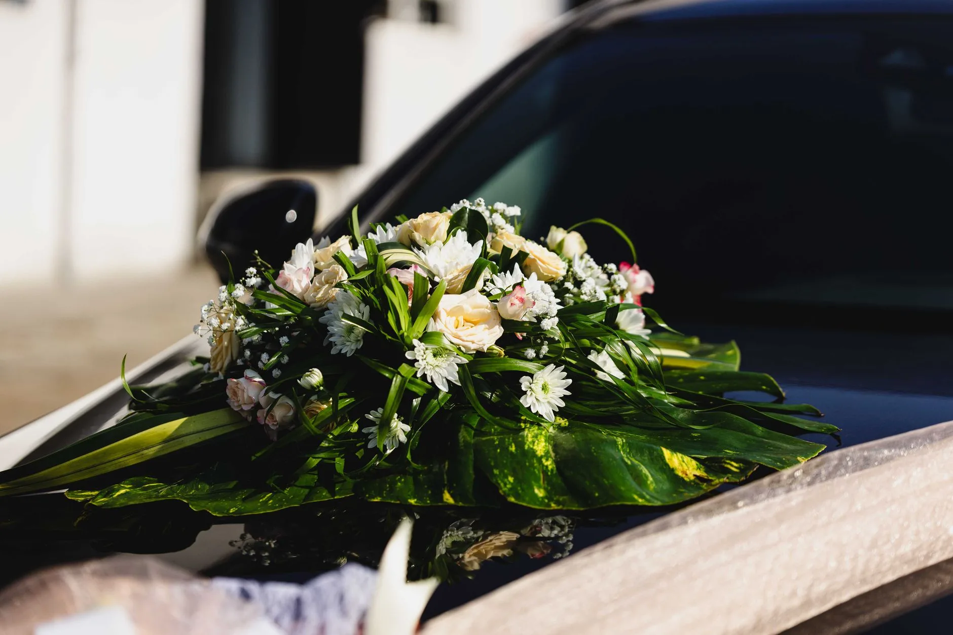 Convertible arriving at a hillside ceremony